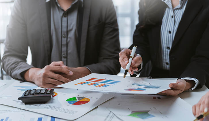 Professional reviewing long term wealth strategy